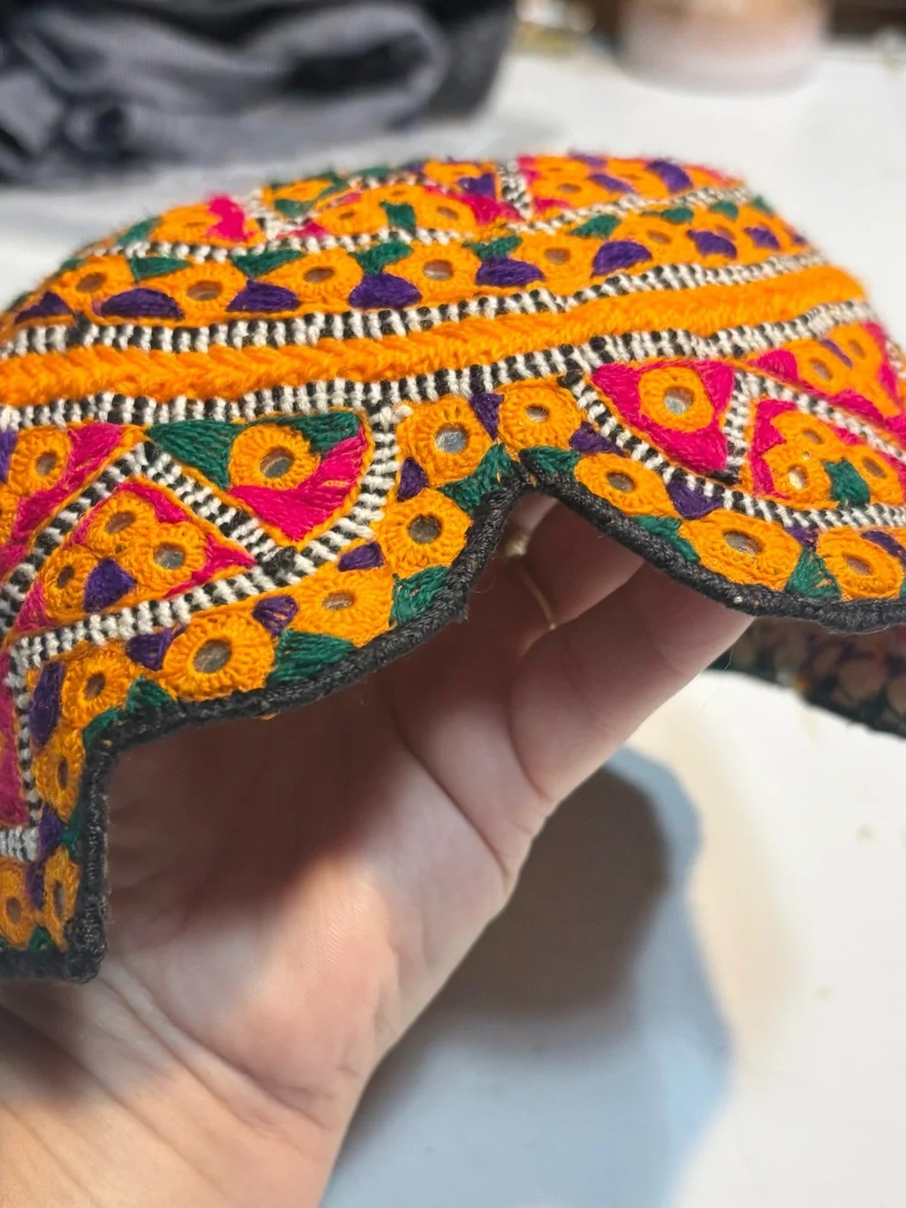 traditional handmade Balochi or Bugti cap featuring vibrant yellow embroidery